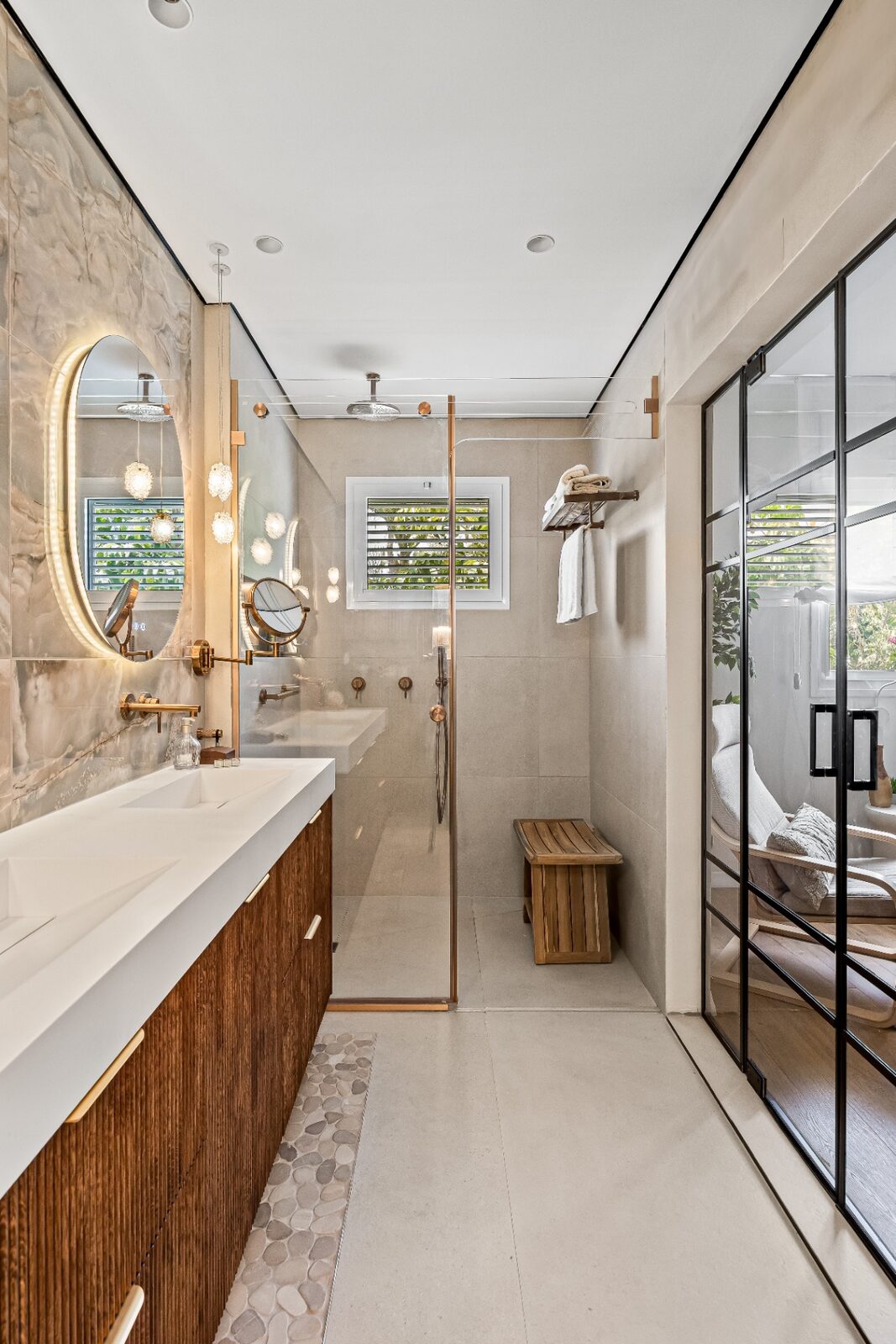 Rishon LeZion bathroom with walk-in shower, teak bench and glass partition