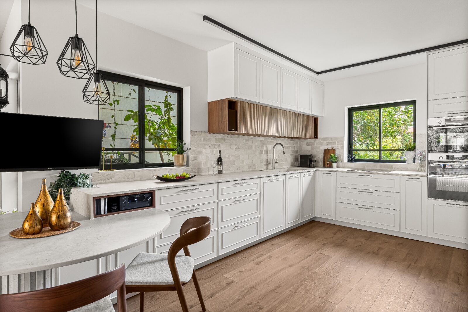 Rishon LeZion panoramic kitchen with stone counters and integrated appliances