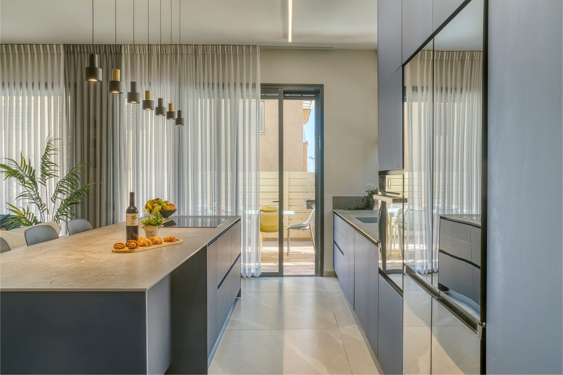 Gedera kitchen with sculptural pendant lights