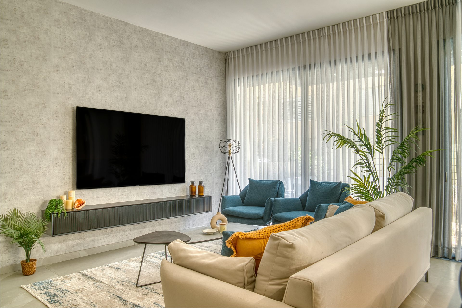 Gedera living room with feature TV wall