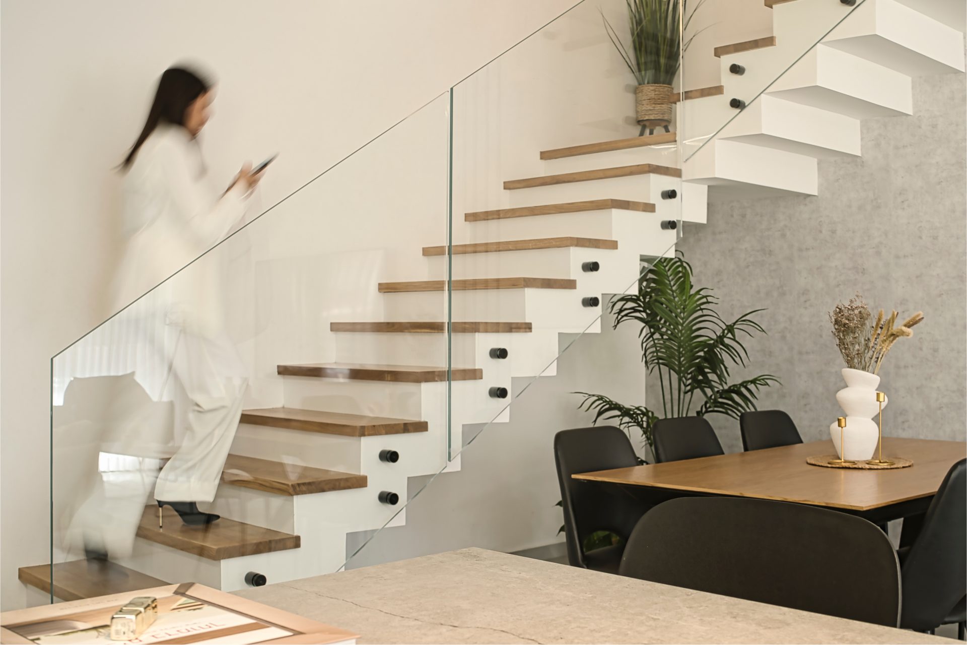 Gedera floating staircase beside the dining area