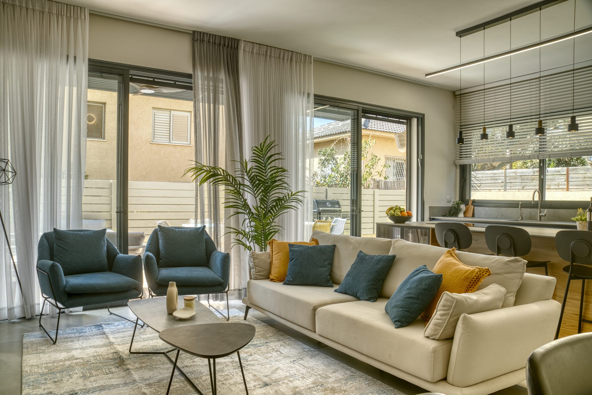 Gedera living room with sofa bathed in natural light